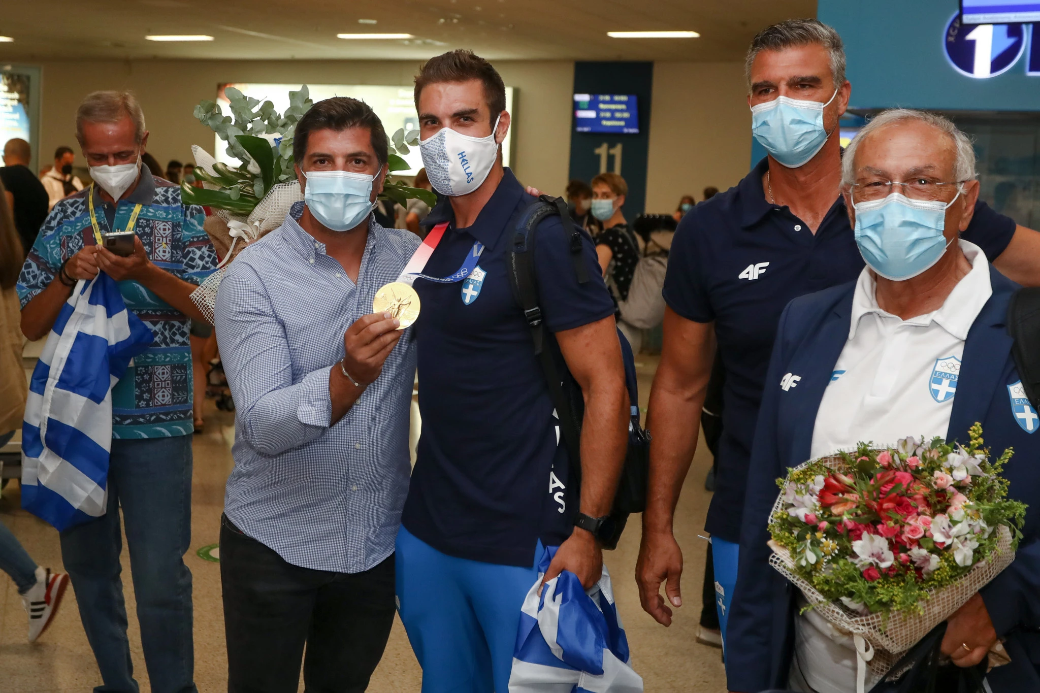 O Ποστιλιόνε στο αεροδρόμιο στην άφιξη του χρυσού Ολυμπιονίκη Στέφανου Ντούσκου / Πηγή: Eurokinissi
